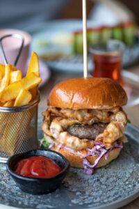 hamburger with fried meat and chips
