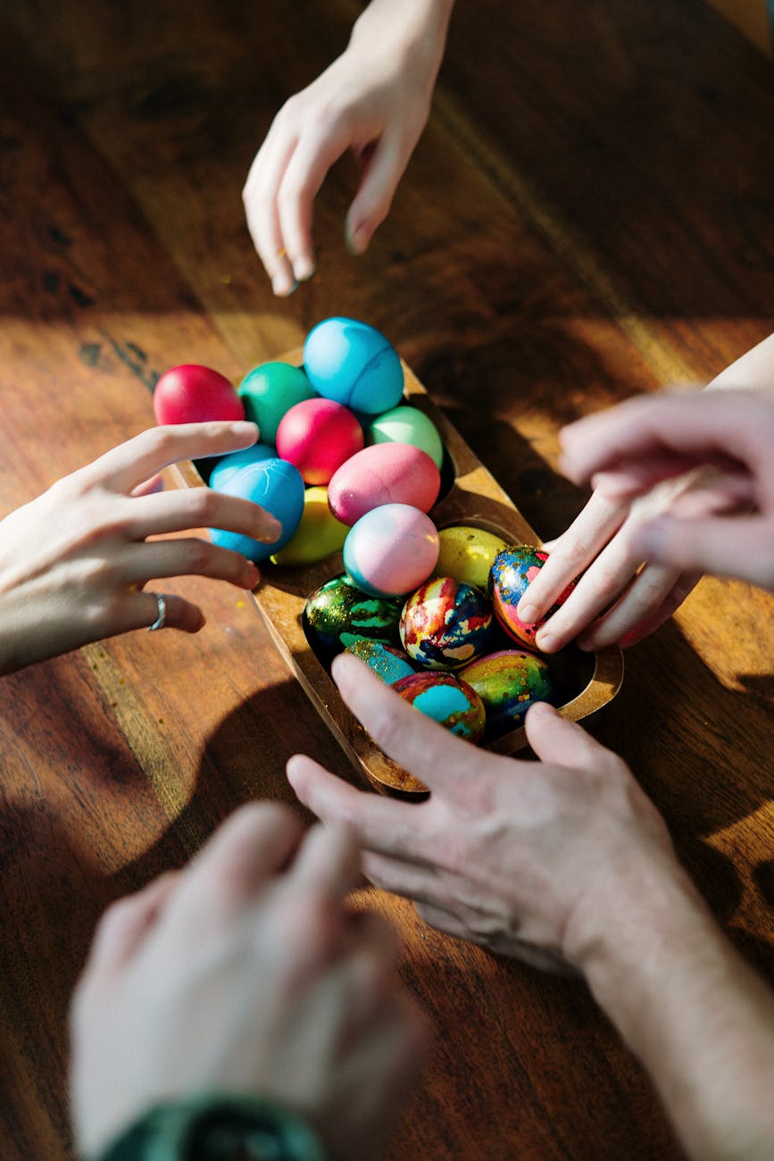 people holding assorted easter eggs