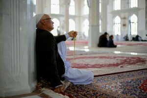 man praying in mosque