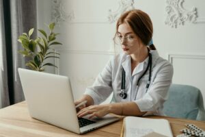 doctor working on laptop